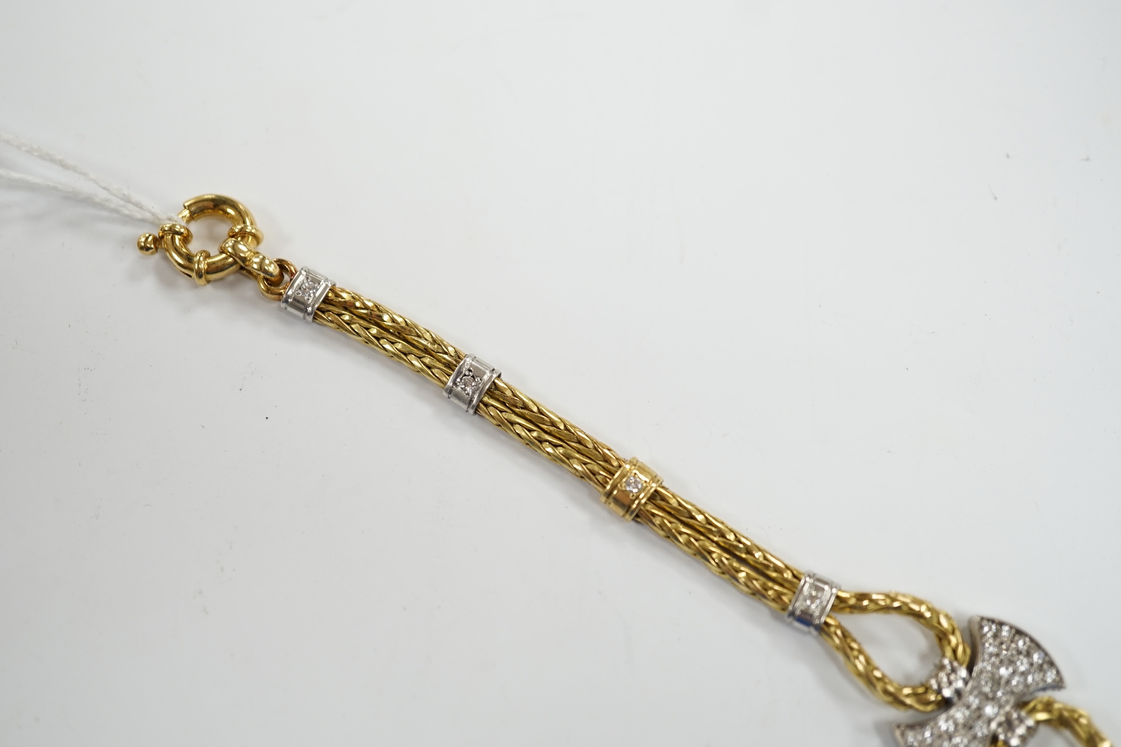 A modern 750 yellow metal and diamond cluster set bracelet, 21.5cm, gross weight 33.9 grams.